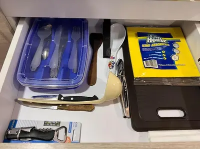 a drawer filled with kitchen utensils and a knife at Comfy loft in Laureles in Medellín