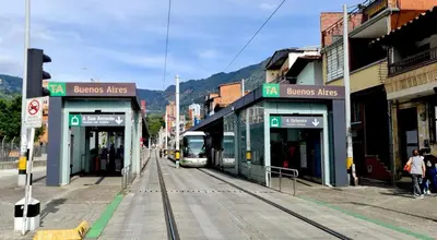 a train on the tracks at a train station at 1BR Air Conditioned Studio Buenos Aires in Medellín