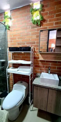 a bathroom with a toilet and a sink at 1BR Air Conditioned Studio Buenos Aires in Medellín