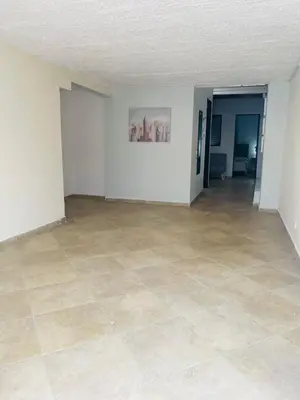 an empty room with a tile floor and white walls at Hermoso apartamento con estacionamiento in Medellín