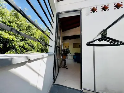 an open door of a house with a balcony at Duplex apartment in Medellín
