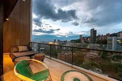 a balcony with a view of a city at Energy Living - Ultimate Condo in Medellin in Medellín