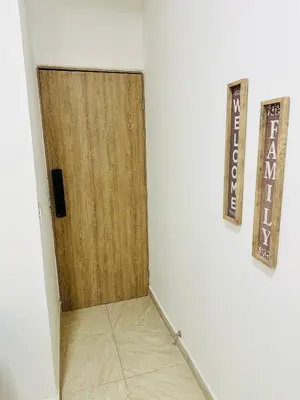 a wooden door in a room with a tile floor at Apartamento en San Diego La Candelaria cerca al centro de Medellín in Medellín