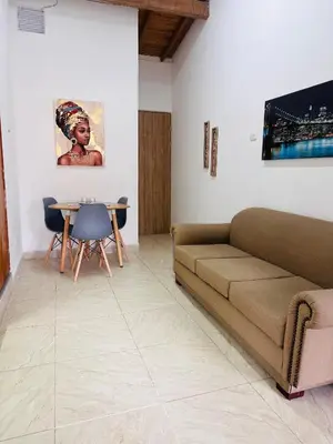a living room with a couch and a table at Apartamento en San Diego La Candelaria cerca al centro de Medellín in Medellín