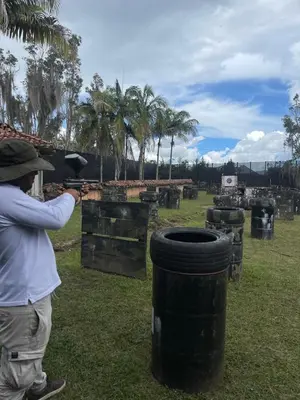 a man is taking a picture of a barrel at Serenity house Guatapé in Guatapé