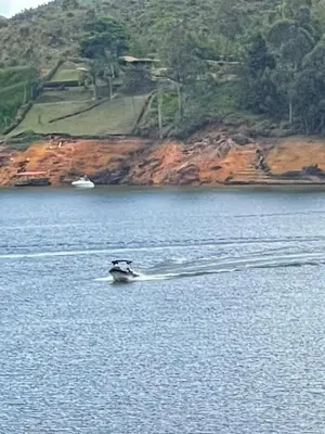a person on a boat in the water at Serenity house Guatapé in Guatapé
