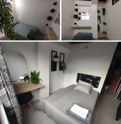 a living room with a bed and a table at Apartamento en Itagüí in Itagüí