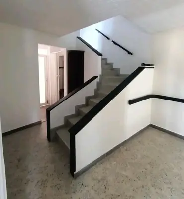 an empty room with stairs in a house at Acogedor Aparta Hotel para 3H Belén Rosales apt 202 in Medellín