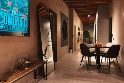 a dining room with a table and chairs at URBAN COMFORT POBLADO SUIT's in Medellín