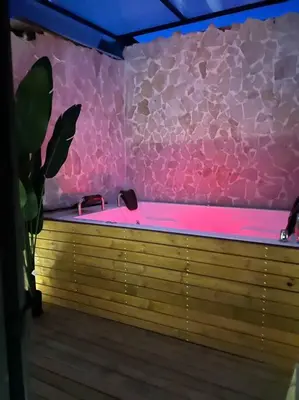a pink bath room with a pink bath tub at URBAN COMFORT POBLADO SUIT's in Medellín
