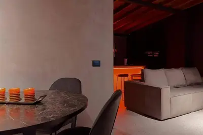 a living room with a table and a couch at URBAN COMFORT POBLADO SUIT's in Medellín