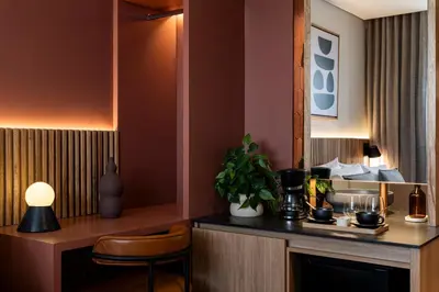 a hotel room with a desk and a chair at Heiss Hotel By Jalo in Medellín