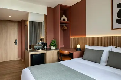 a hotel room with a bed and a desk at Heiss Hotel By Jalo in Medellín
