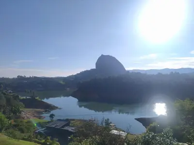 a view of a lake with a mountain in the background at Cabaña Estancia Primavera in Guatapé