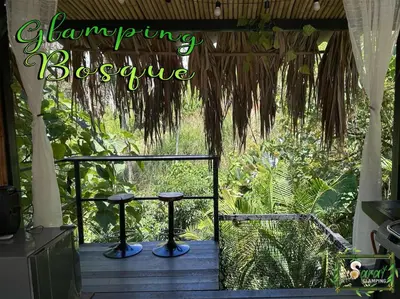 a porch with a sign that reads swinging brewery at Saray glamping in Palestina
