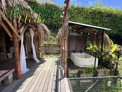a bathroom with a bath tub in a building at Saray glamping in Palestina