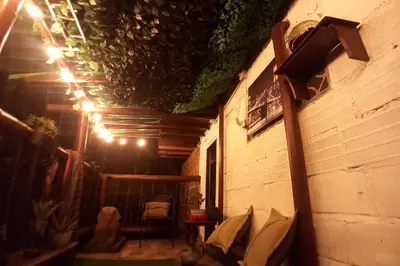 a room with a building with a table and a chair at Boresta House -Santa Elena con vista al Bosque y terraza privada in Medellín
