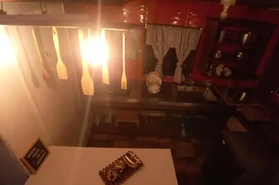 an overhead view of a kitchen with a table and utensils at Boresta House -Santa Elena con vista al Bosque y terraza privada in Medellín