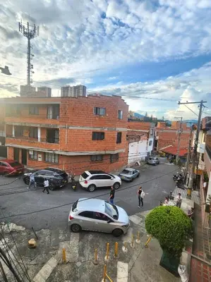 a street with cars parked in a parking lot at EXCLUSIVO y ELEGANTE APARTAMENTO in Medellín