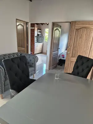a meeting room with a table and two chairs at EXCLUSIVO y ELEGANTE APARTAMENTO in Medellín