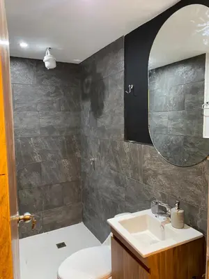 a bathroom with a sink and a mirror at Finca hotel xamai in Guatapé