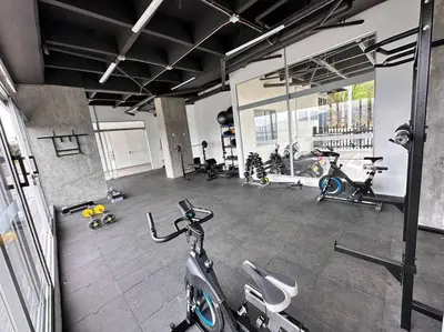 a gym with a scooter parked in a room at Amazing view Modern Apartment in Sabaneta in Sabaneta