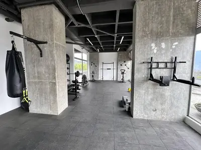 a large room with a gym with punching bags on the walls at Amazing view Modern Apartment in Sabaneta in Sabaneta