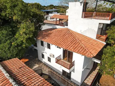 an overhead view of a white building with an orange roof at hotel montana Doradal in Doradal