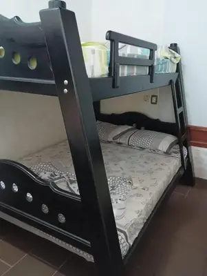 a black bunk bed with the bottom bunk of a room at Agua Azul Cabaña 87 in San Jerónimo