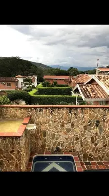 a view of a stone building with a window at Agua Azul Cabaña 87 in San Jerónimo