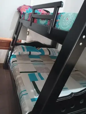 a bunk bed in a dorm room with a bunk bedutenewayangering at Agua Azul Cabaña 87 in San Jerónimo