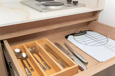 a drawer with utensils in a kitchen at 81 Living by Simple Stay in Medellín