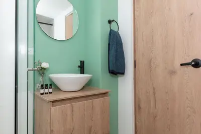 a bathroom with a sink and a mirror at 81 Living by Simple Stay in Medellín