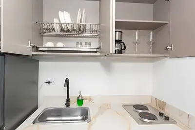 a kitchen with a sink and a counter top at 81 Living by Simple Stay in Medellín