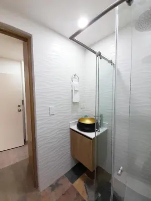 a bathroom with a sink and a shower at MEDELLIN CÓMODOS APARTAESTUDIOS in Medellín