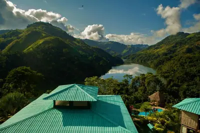 a view of a river in a valley with mountains at Ecohotel Campo Alegre Norcasia Caldas in Norcasia