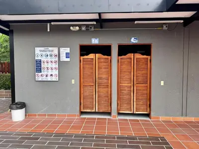 a row of wooden doors on a building at Apartamentos de lujos para descansar Oasis in San Jerónimo