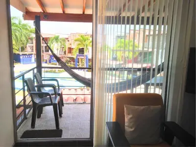 a room with a window with a view of a pool at 