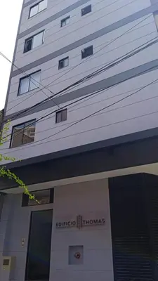 a tall white building with a sign on it at Apartamento exclusivo en Sabaneta, Antioquia in Sabaneta