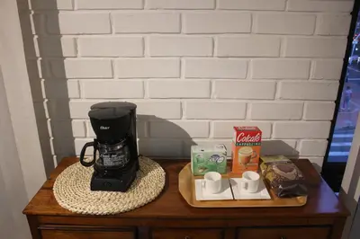 a coffee maker sitting on top of a table at Excelente Apartamento en Parque El Poblado in Medellín