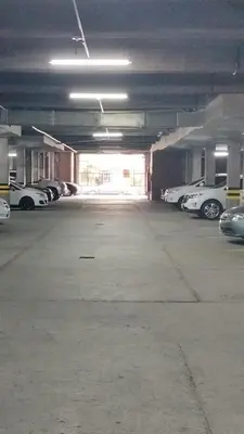 an empty parking garage with cars parked in it at Excelente Apartamento en Parque El Poblado in Medellín