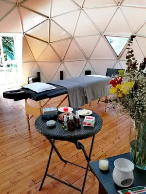 a room with a bed and a table in a yurt at Pietrasanta Home in Rionegro