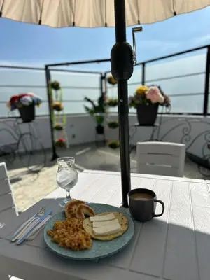 a plate of cheese and bread on a table at Hotel LAX78 in Medellín