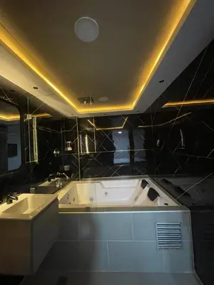 a bathroom with two sinks and a bath tub at Hotel LAX78 in Medellín