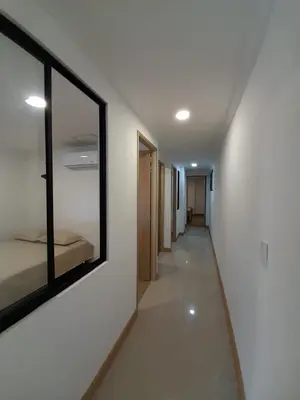 a hallway with a mirror on the wall at Medellin laureles mejor ubicación in Medellín