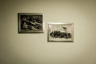 two framed photographs of a car on a wall at Apartamento Rosales in Medellín