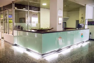 a lobby with a large aquarium in a building at Hotel Mall Santana Del Río in La Dorada