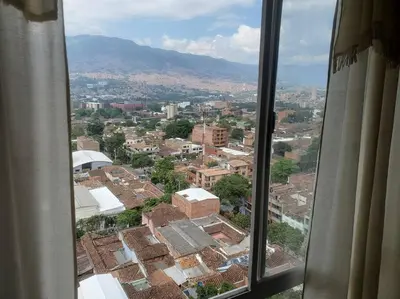 a view of a city from a window at Mde Escape in Medellín
