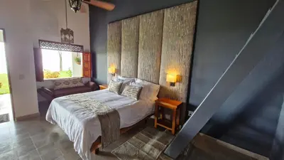 a bedroom with a large bed and a window at Casa Finca Madrid Mazzitelli in Támesis
