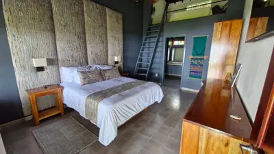 a bedroom with a bed and a wooden wall at Casa Finca Madrid Mazzitelli in Támesis